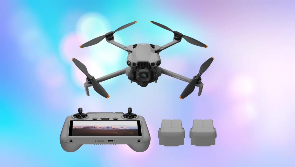 Folded compact camera drone held in one hand