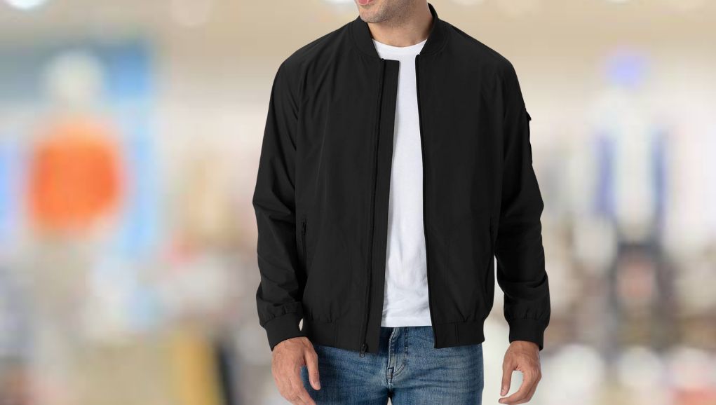 Row of bomber jackets hanging on a clothing rail